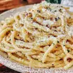 creamy homemade cacio e pepe bucatini - featured image